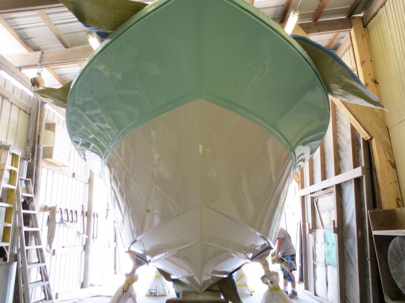 All previous anti-fouling removed. The custom color application is completed on the hull.
